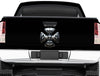 black truck tailgate door with chrome skull maltese cross vinyl graphics on it