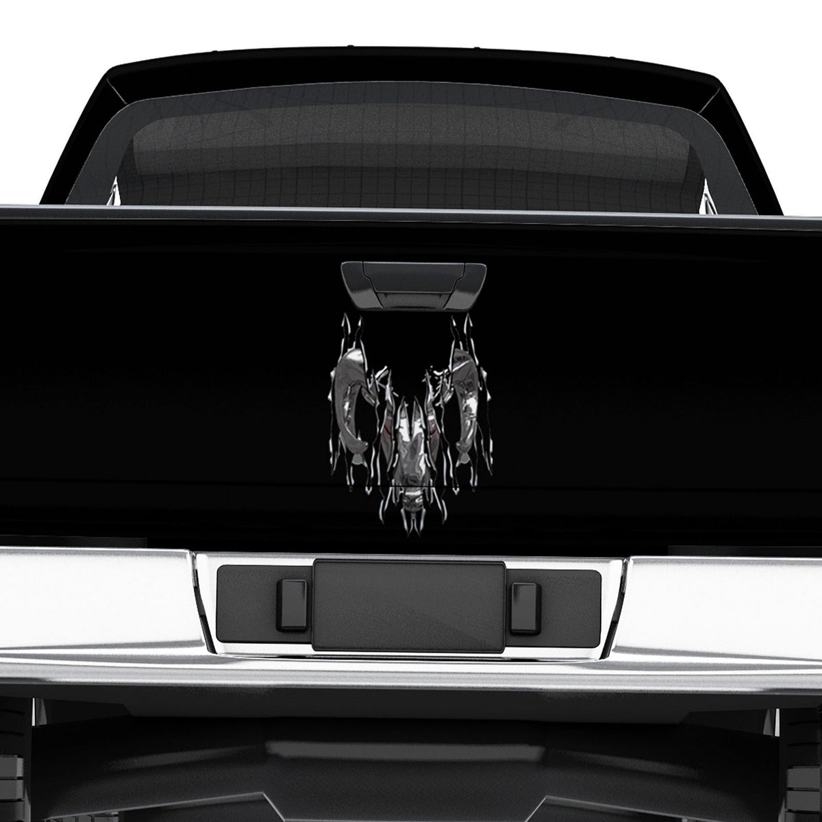 Black truck with a torn chrome ram head on tailgate 