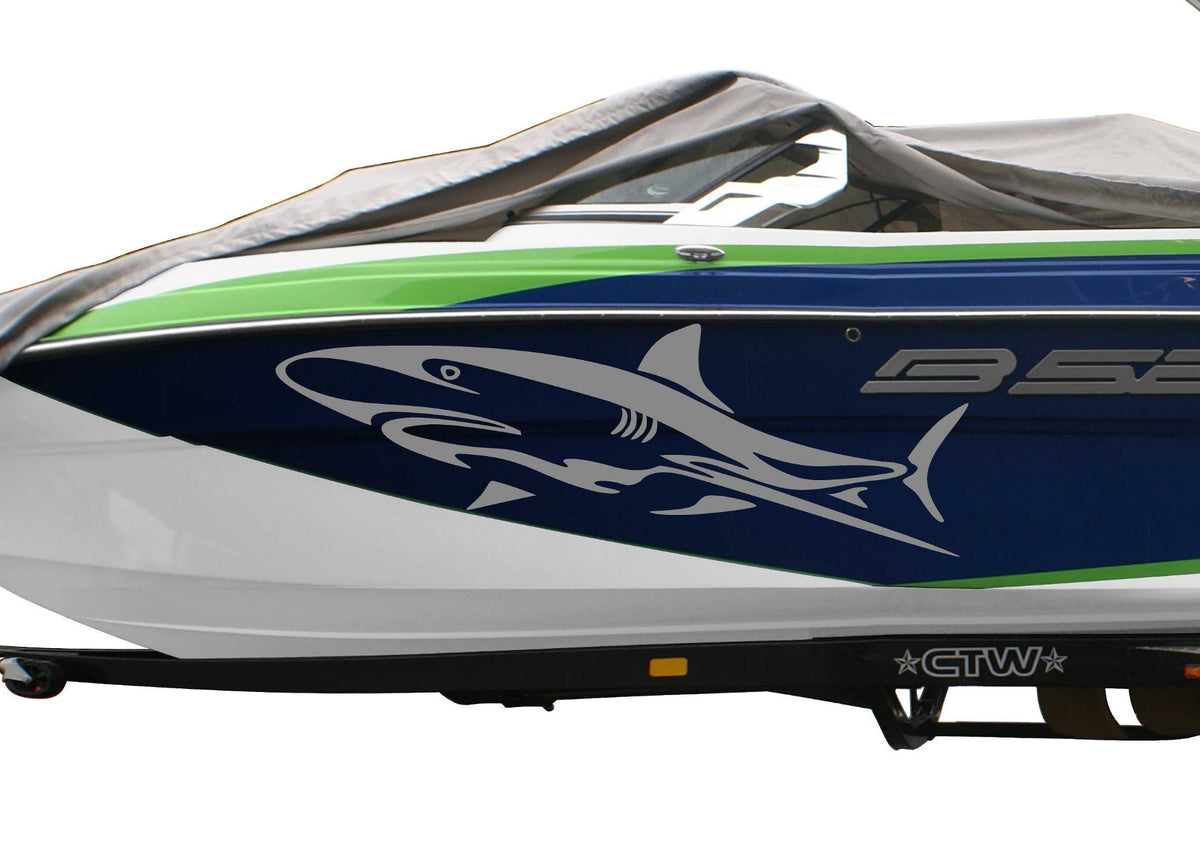 blue boat with silver vinyl cut shark decal on port side