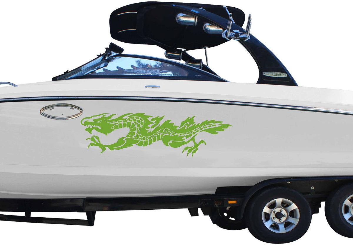 White boat with a green flaming dragon decal on a white background