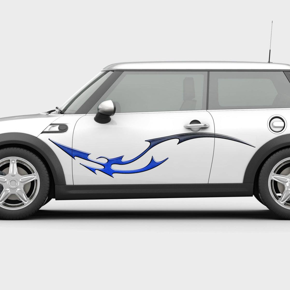white mini cooper with dragon tail decal on the side 