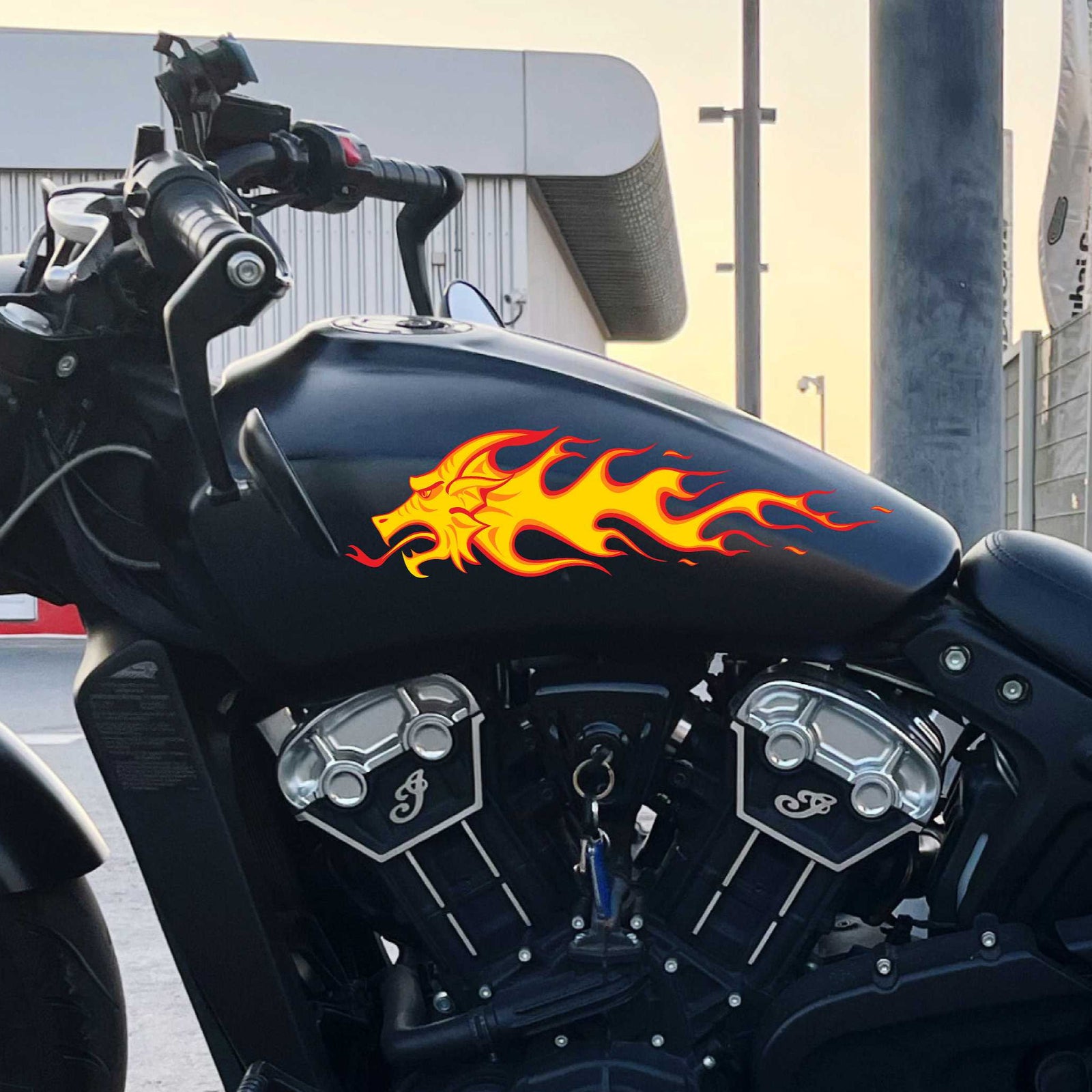 dragon flames decal on the gas tank of black motocycle