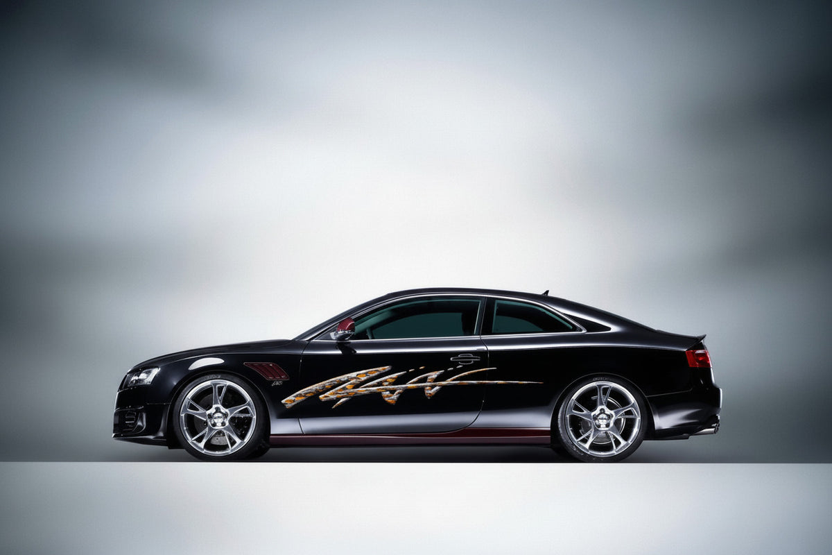 black sports car with flaming spear arc vinyl decal on driver side