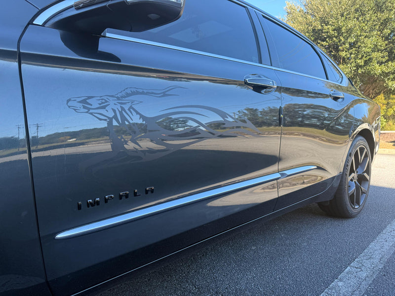 gray chevy impala car with matte black impala flames vinyl decals on driver side