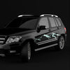 Black SUV with a unique mountain decal design on a black background