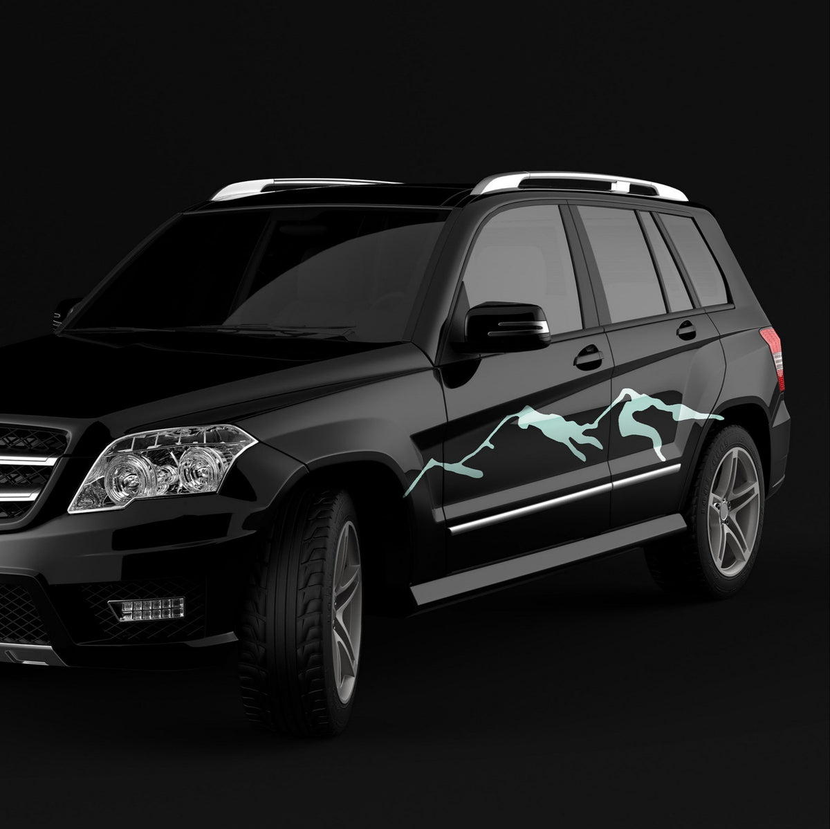 Black SUV with a unique mountain decal design on a black background