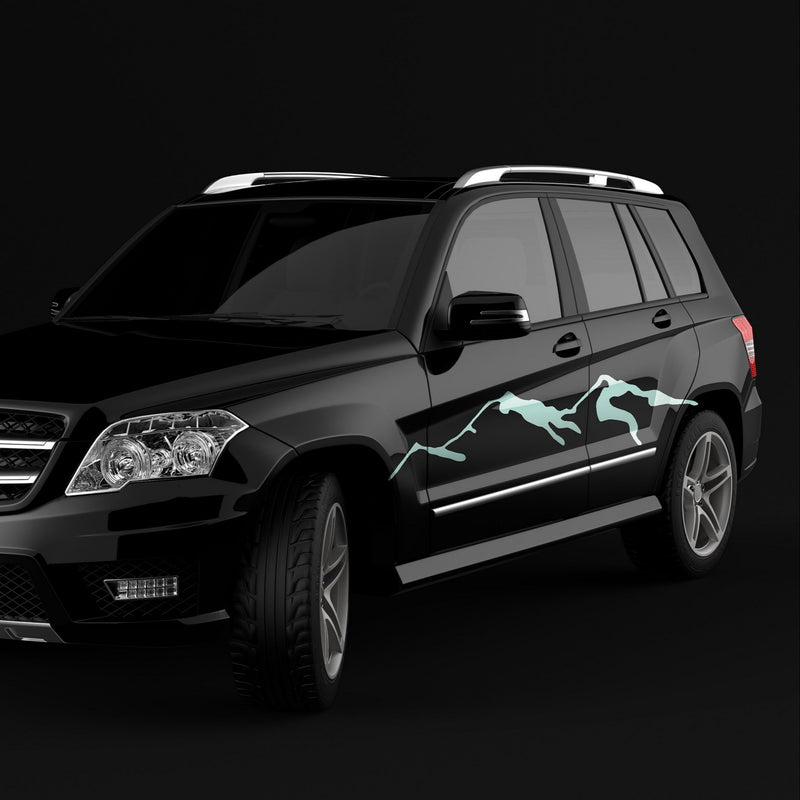 Black SUV with a unique mountain decal design on a black background