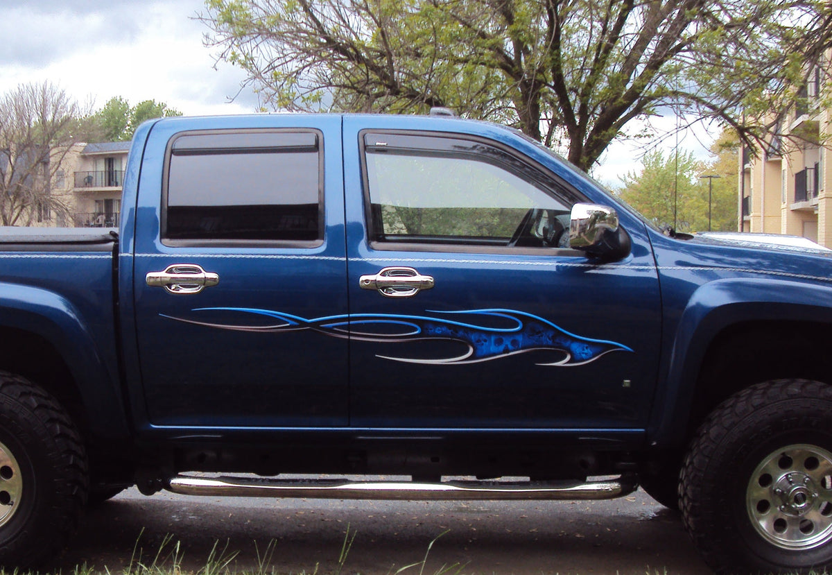 inflame skulls graphic decal on the side of blue truck