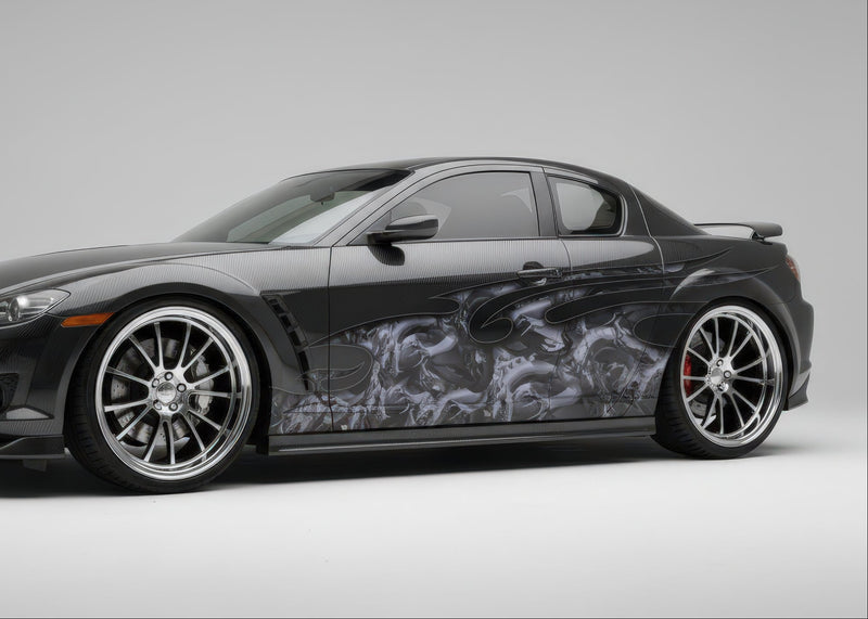 sports car with dragon attack half wrap graphics on driver sdie