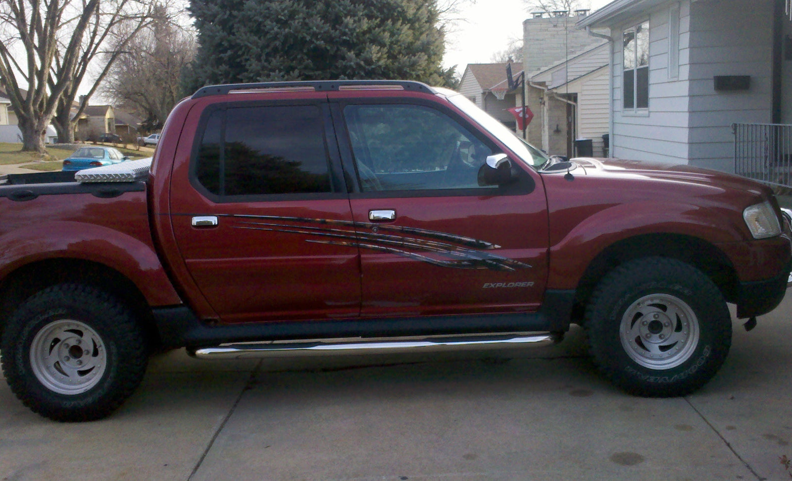 White pickup truck with tribal carbon fibre  stripe graphics on a white on it side