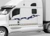 white big rig semi with blue tribal decal stripe across the cab driver side