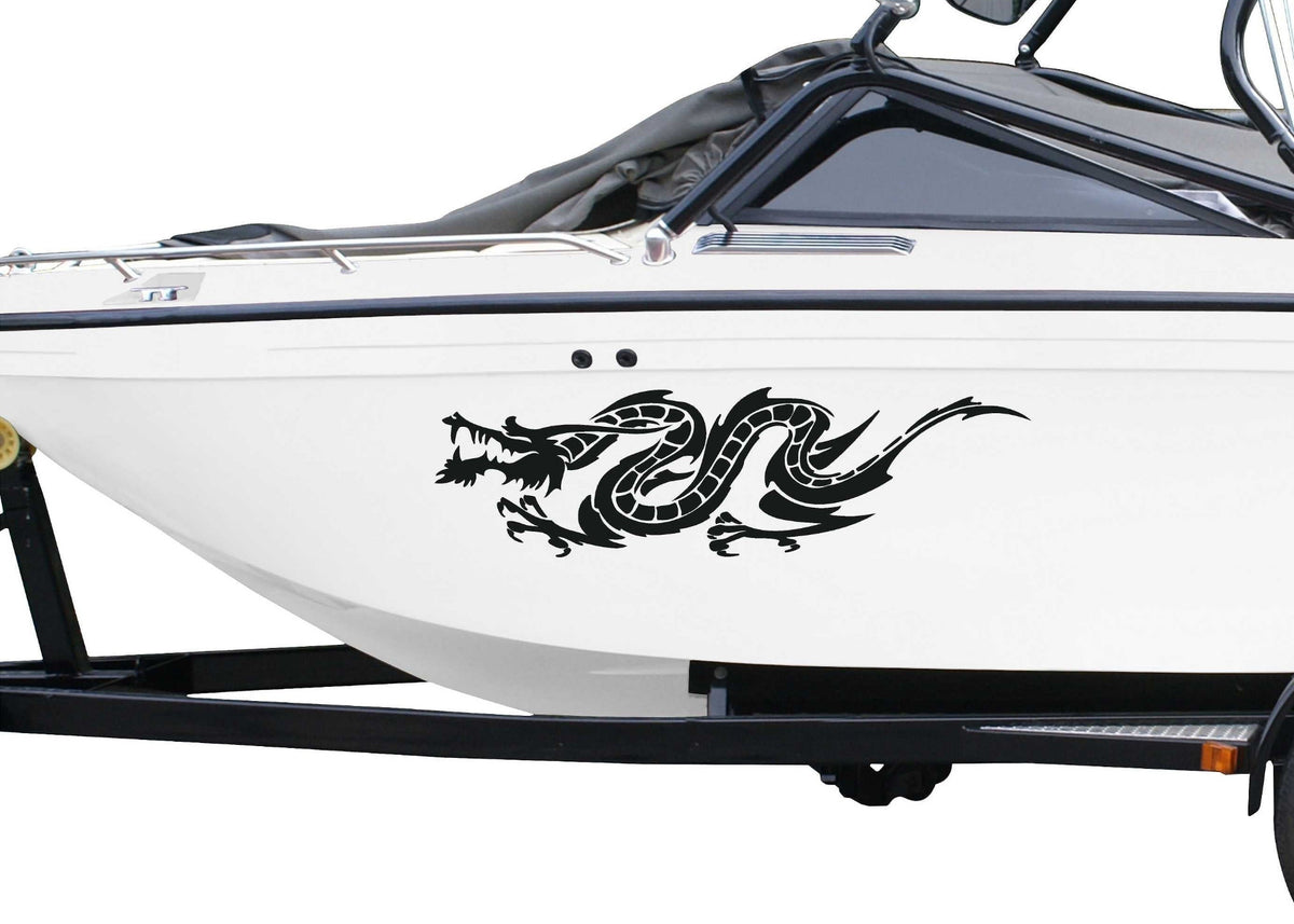 White boat with a black dragon decal on a white background