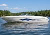 white boat with blue inflame skulls vinyl decal on hull port side