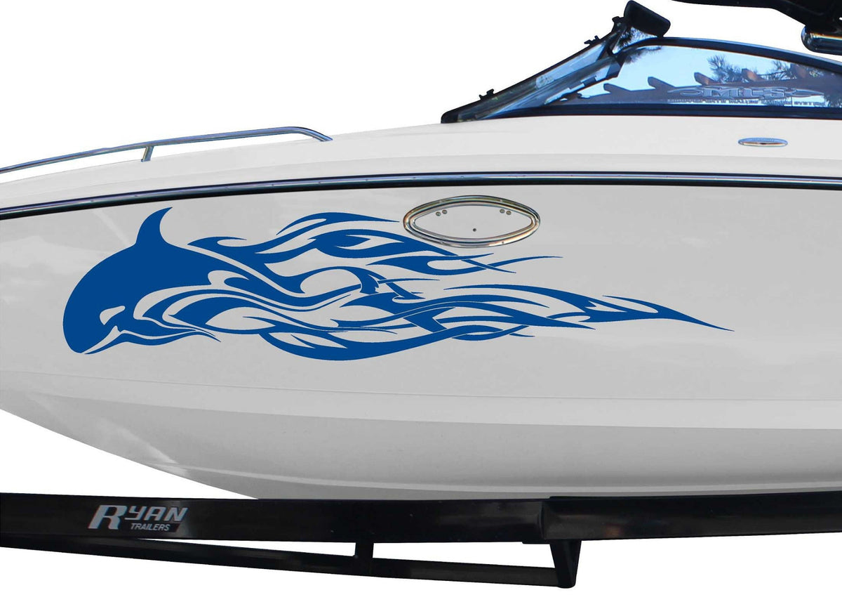white boat with blue orca flames decal on port side