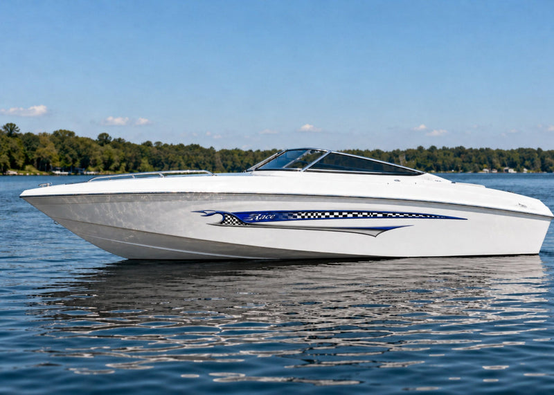 white boat with blue shark racing stripe on its hull