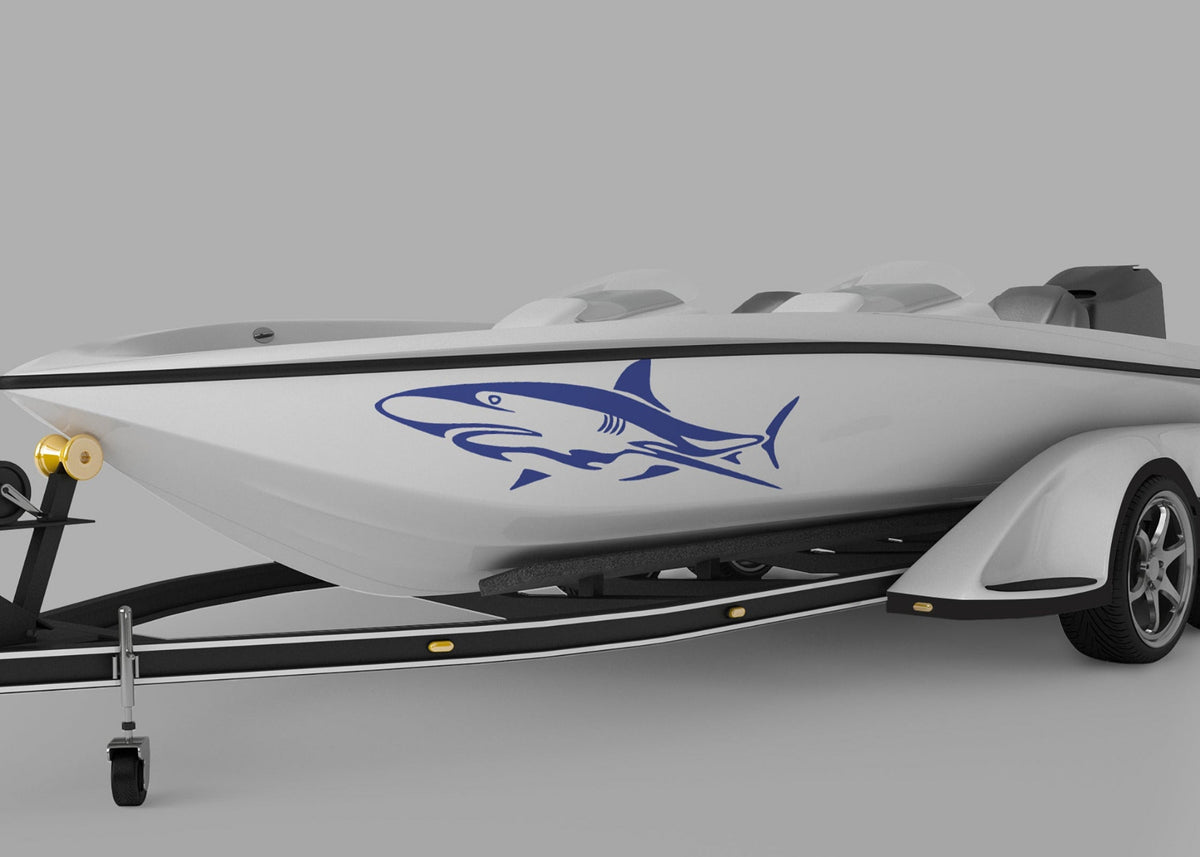 white boat with blue shark vinyl graphics on port side