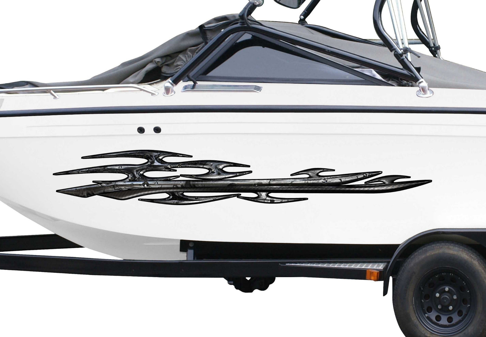 white boat with tribal dark metallic style vinyl decal on its side