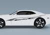 white camaro with black carbon fiber stripe decal on driver side