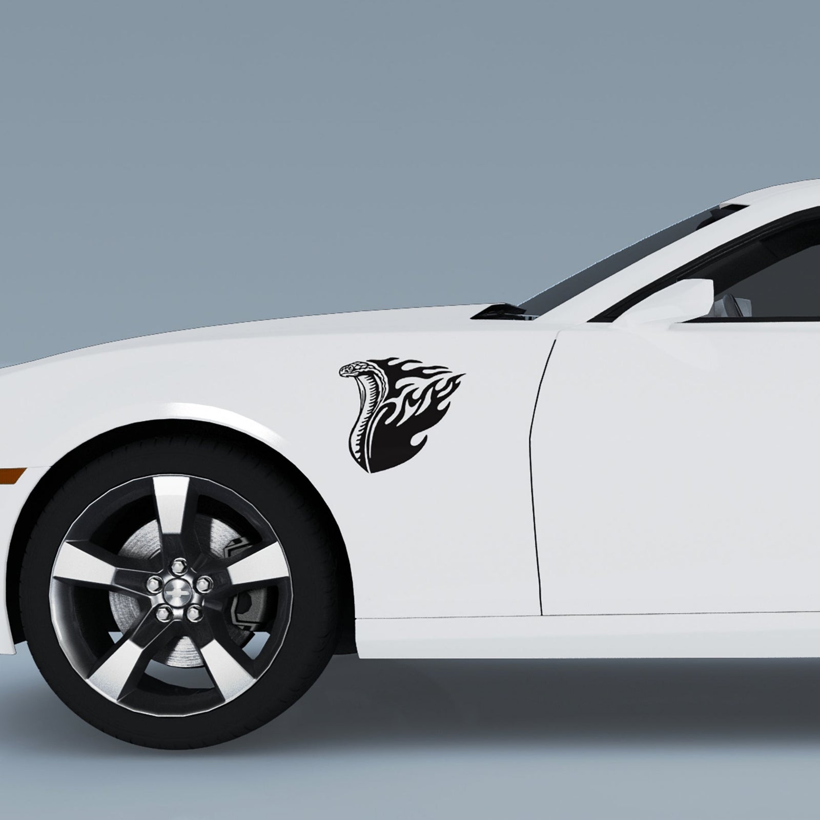 Yellow muscle car with a black cobra flames design on its front side 