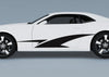 white camaro with black vinyl stripes on driver side