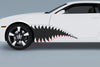white camaro with fighter jet style teeth vinyl graphics on driver side