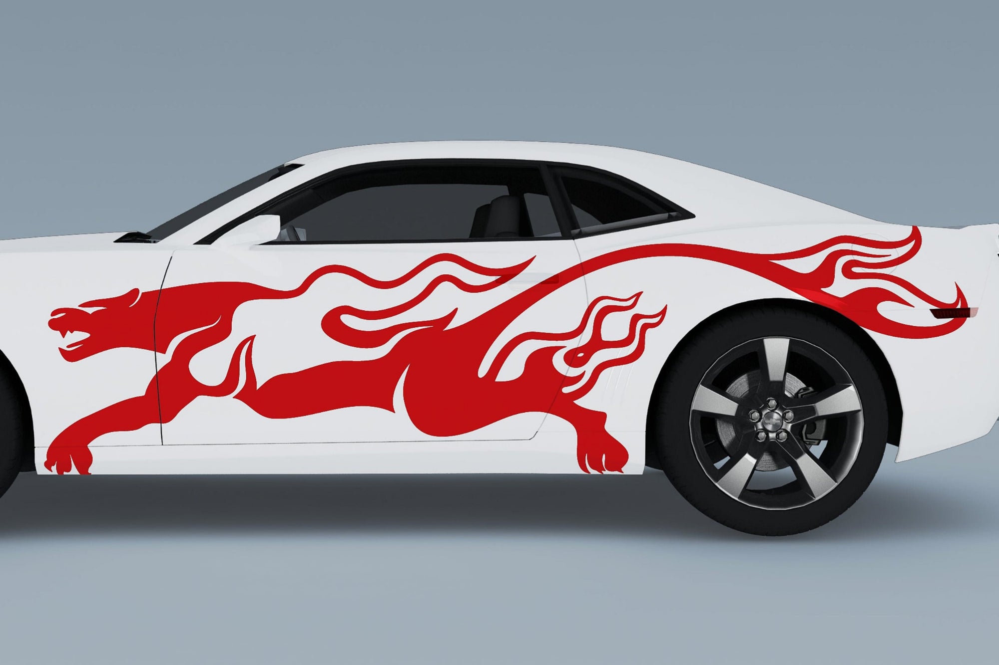 white camaro with red puma flames vinyl cut graphics on driver side