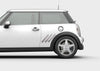 white mini cooper with chrome pipe exhust illusion decal on driver side