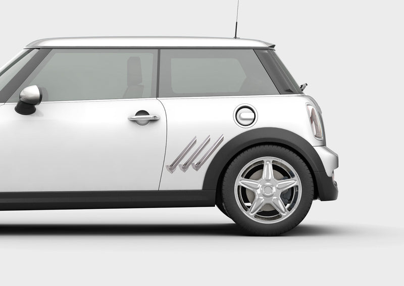 white mini cooper with chrome pipe exhust illusion decal on driver side