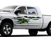 white pickup with Green Monster Rip tear vinyl graphics on driver side