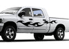 white pickup with black tribal flames decal on driver side