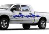 white pickup with blue chrome tribal flames vinyl graphics on driver side