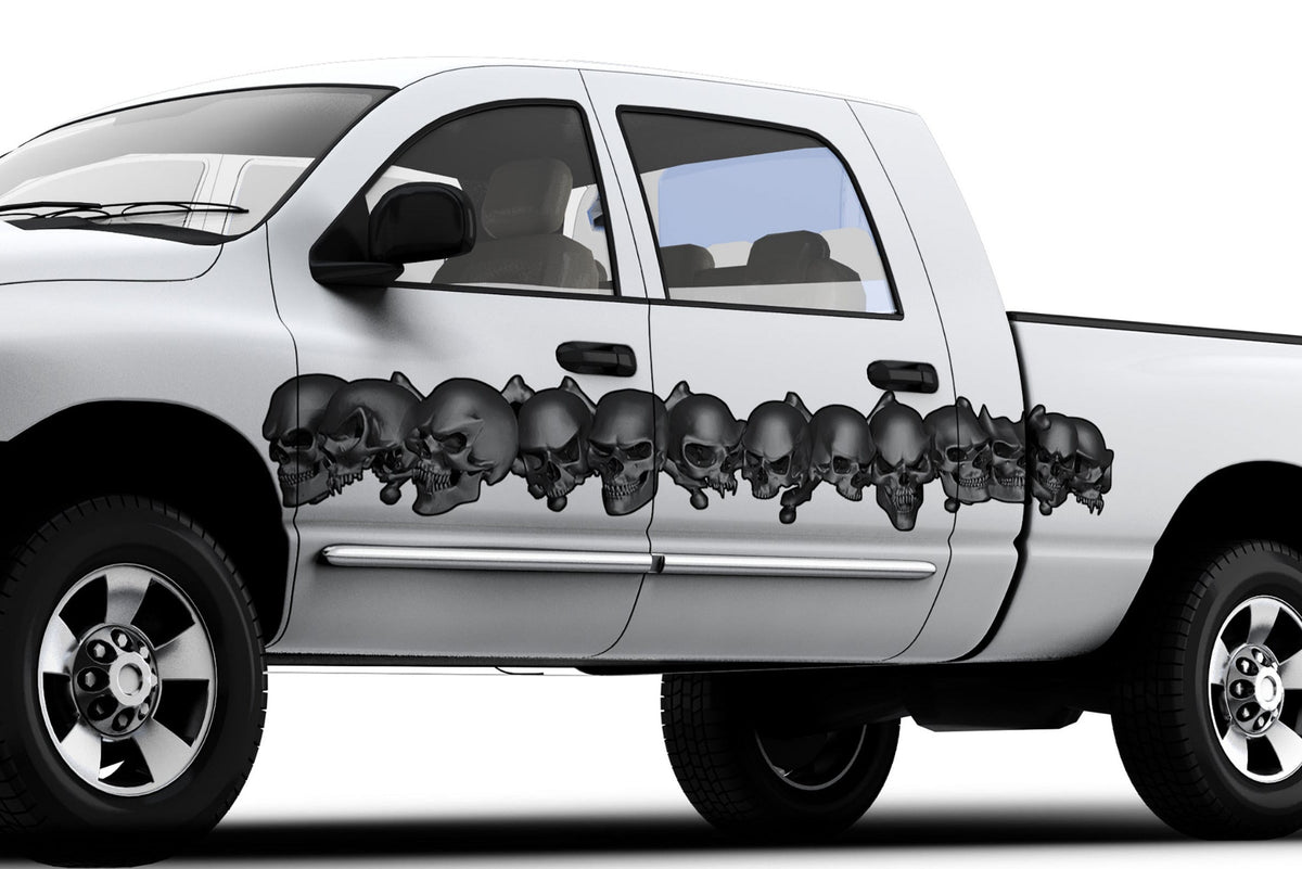 white pickup with dark grey skulls link vinyl graphics on driver side