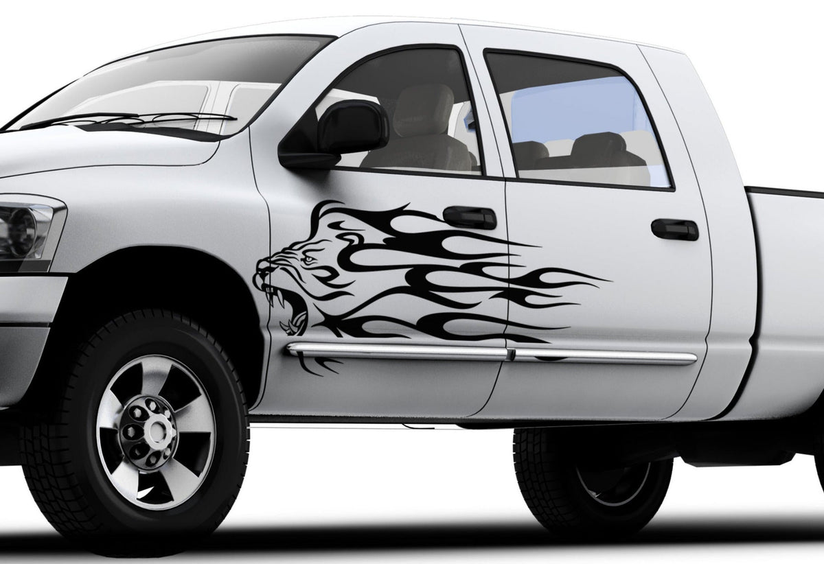 white pickup with lion head flames vinyl cut decal on driver side