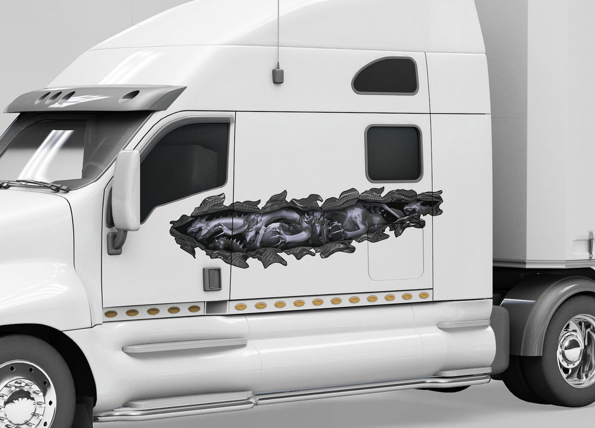 white semi trailer with grey dragon tear vinyl decal on cab driver side