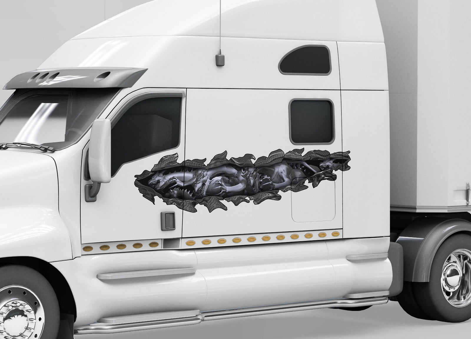 white semi trailer with grey dragon tear vinyl decal on cab driver side