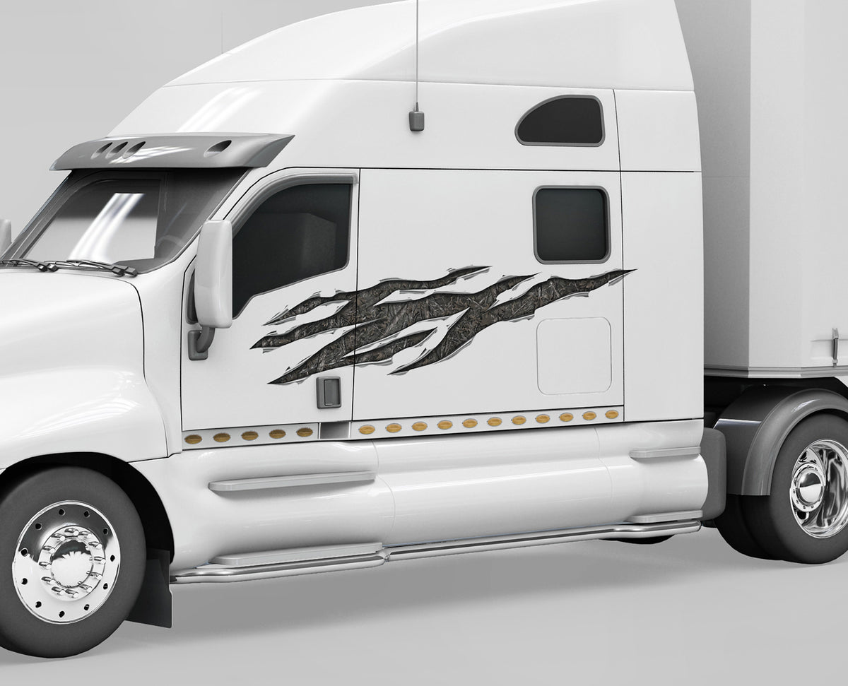 white semi with woodland camo rip vinyl graphics on its driver side
