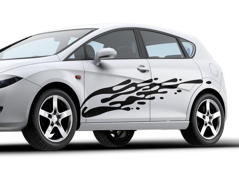 white small hatchback car with black mud splash vinyl decal on driver side