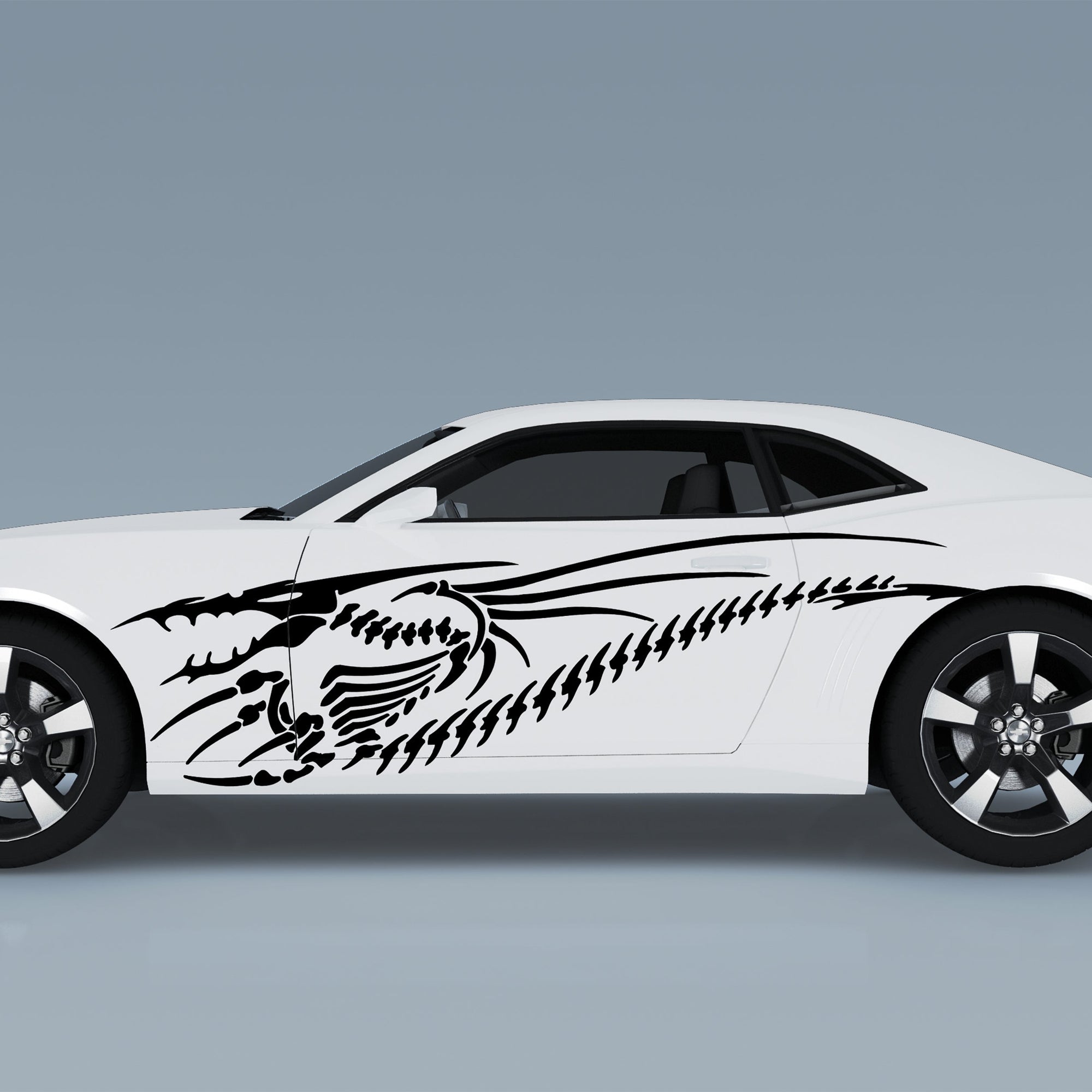 white sports car with black dragon skeleton vinyl decal on driver side