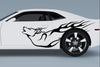 white sports car with howling wolf vinyl cut decal on driver side