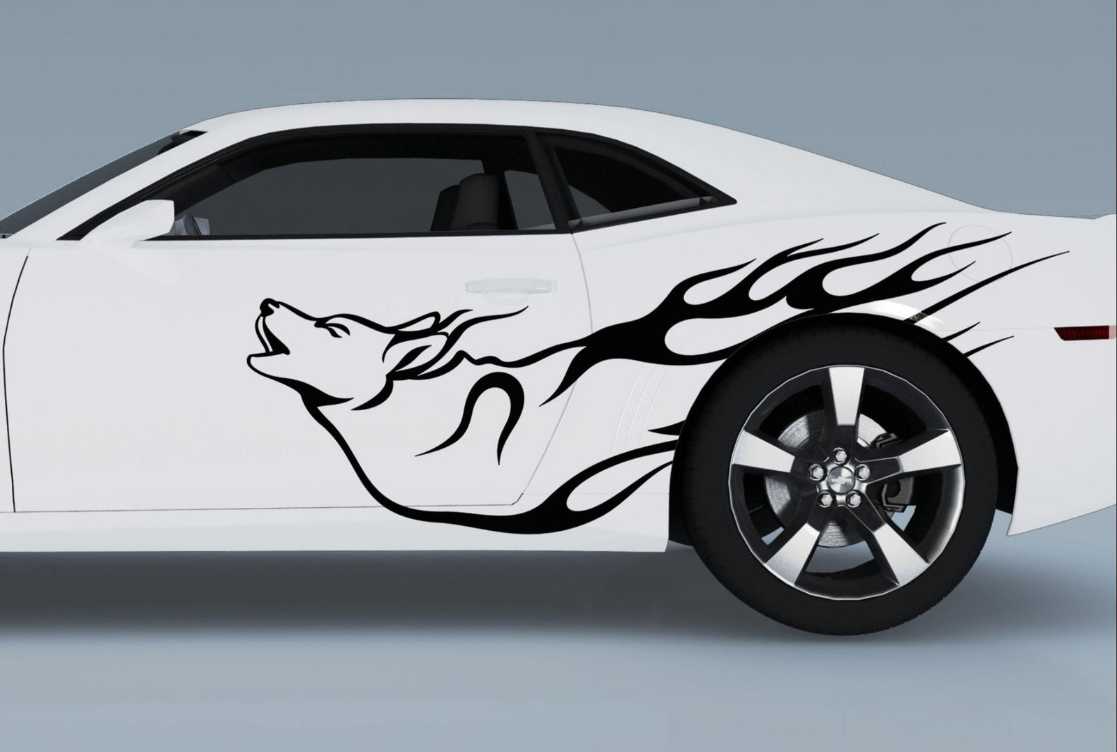 white sports car with howling wolf vinyl cut decal on driver side
