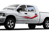 white truck with Red tribal blade vinyl decal on driver side