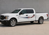 white truck with american flag tribal blade vinyl graphics on driver side