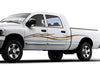 white truck with barbwire orange vinyl graphic stripe on driver side