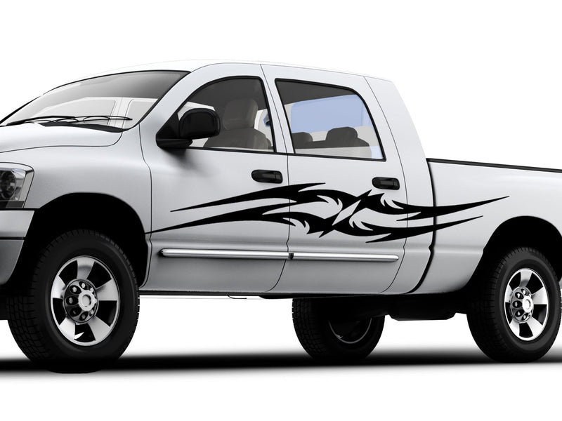 white truck with black tribal spears vinyl decal on driver side