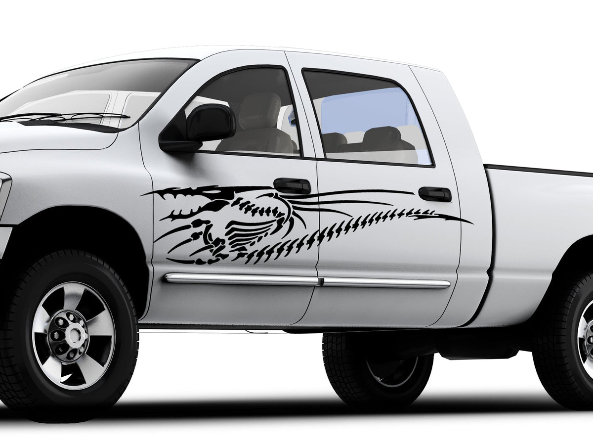 white truck with dragon black dragon skeleton vinyl decal on driver side