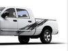 white truck with scratch style 3 black vinyl cut graphics on driver side