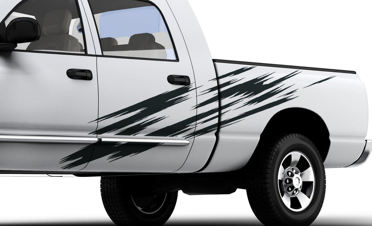 white truck with scratch style 4 vinyl cut graphics on driver side