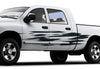 white truck with scratch style 4 vinyl stripes decals on its driver side