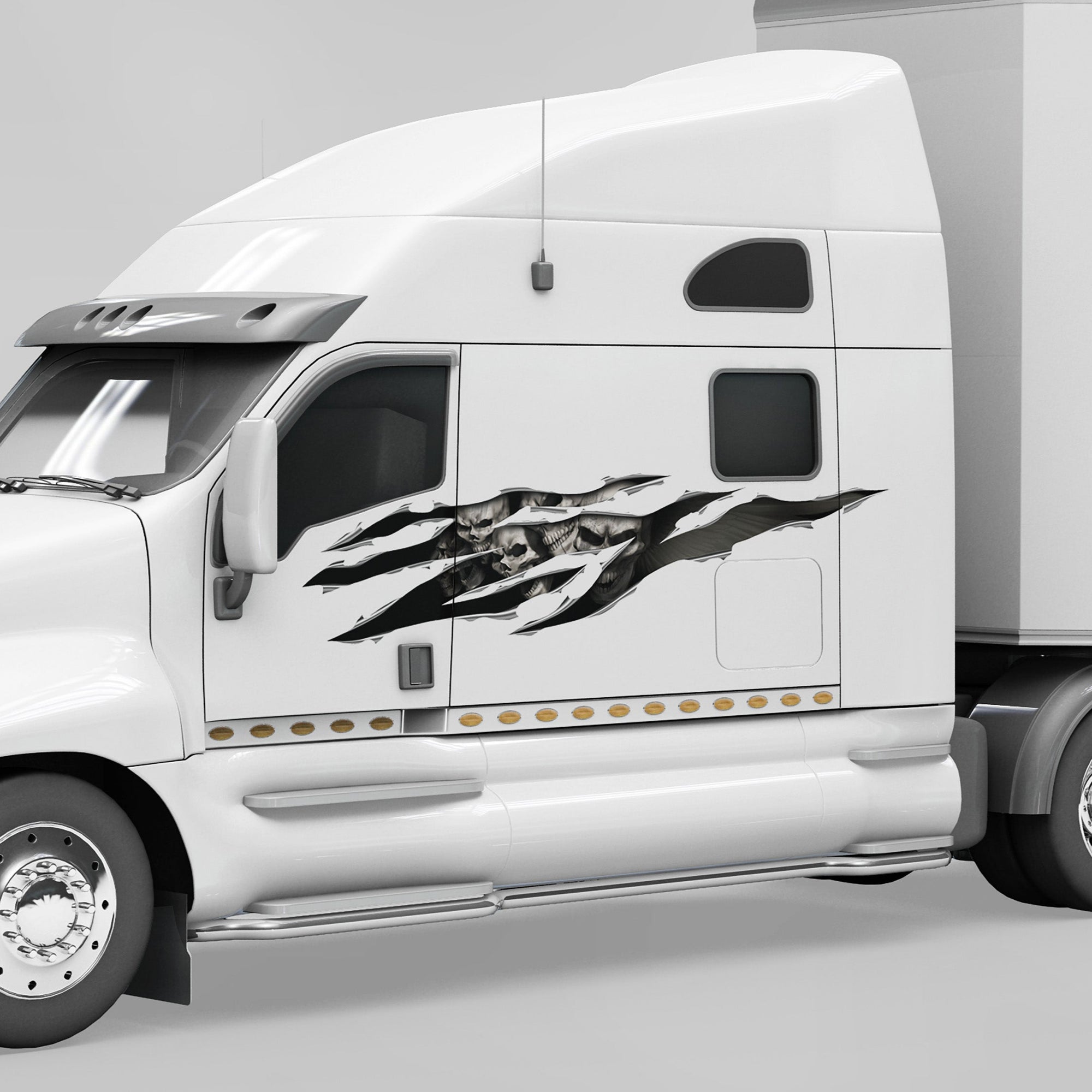 white truck with skulls big rip decal on driver side