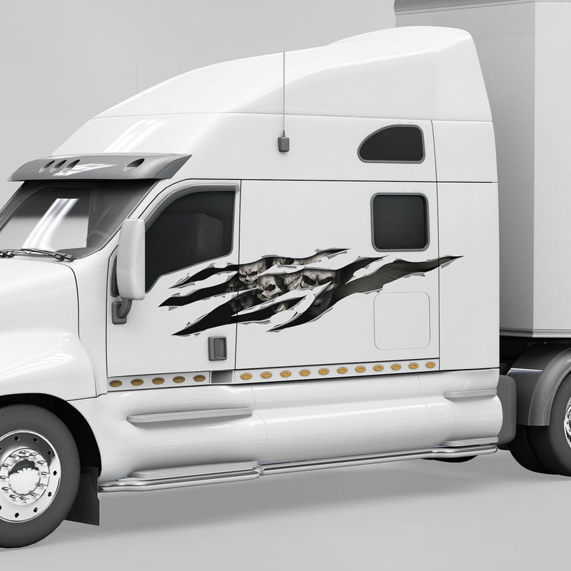 white semi big rig with large skulls rip tear decal on driver side